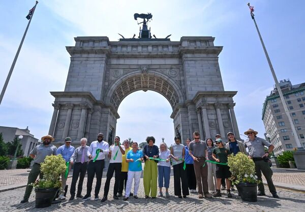 Ribbon cutting ceremony for the restored arch
