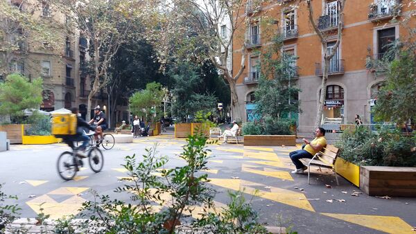 Barcelona Superblock in Sant Antoni — trees, benches, and cyclists where cars used to be